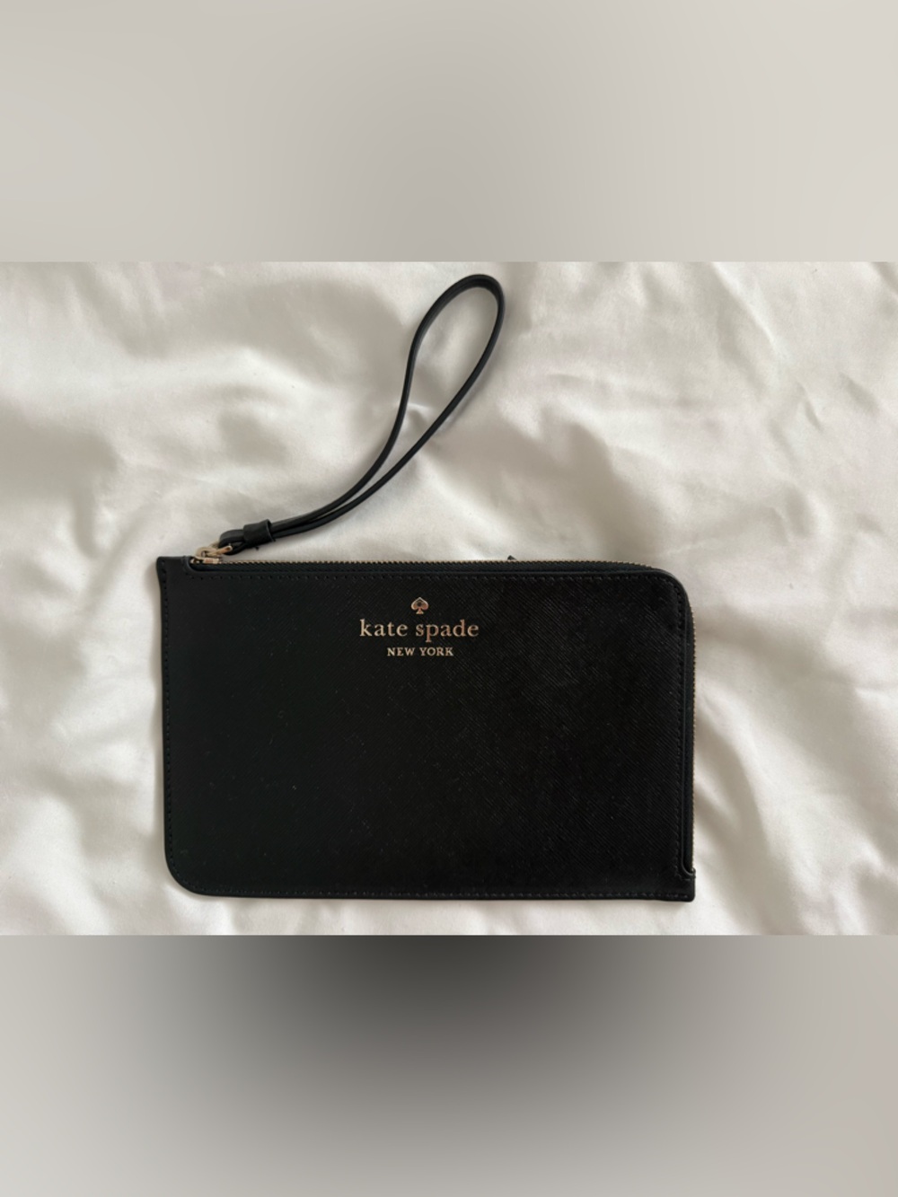 kate spade black wristlet with gold logo